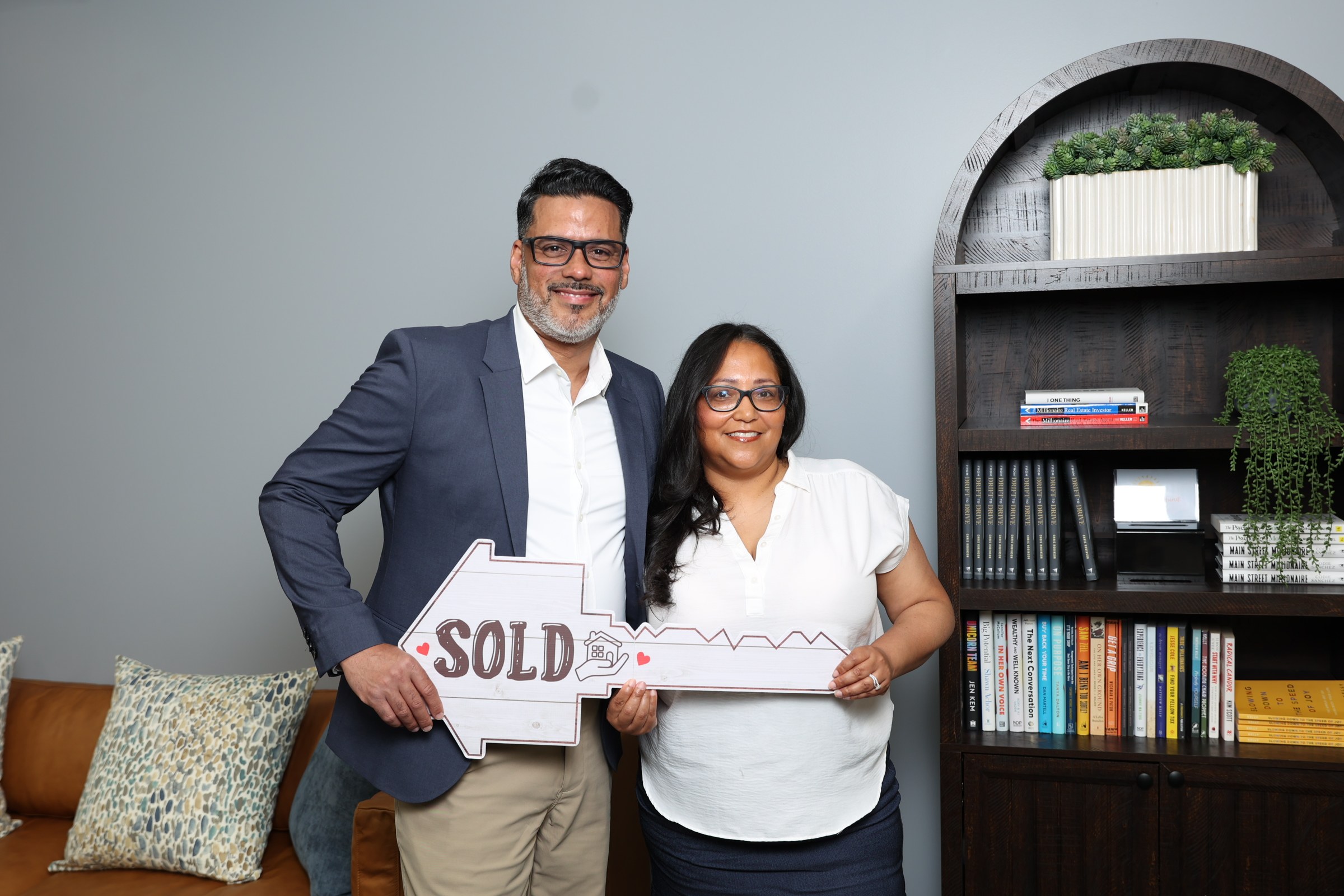 Damaris Rodriguez celebrating a sold home with a client